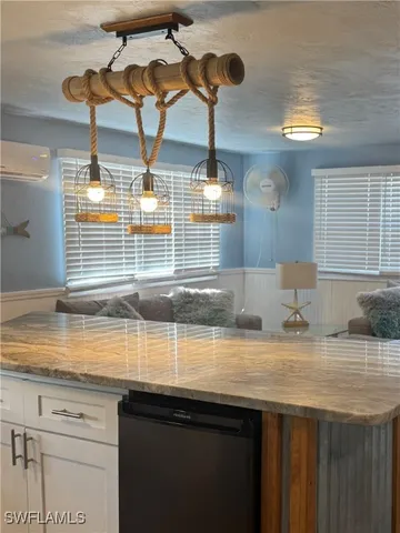 a kitchen with a sink and a window