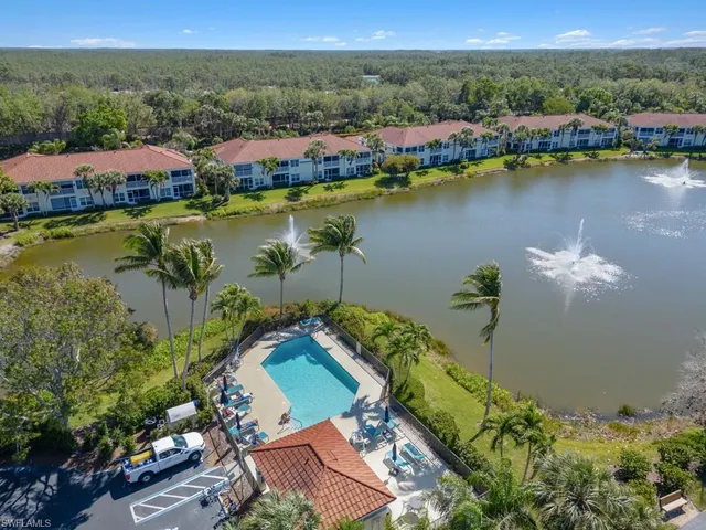 an aerial view of a house with a lake view