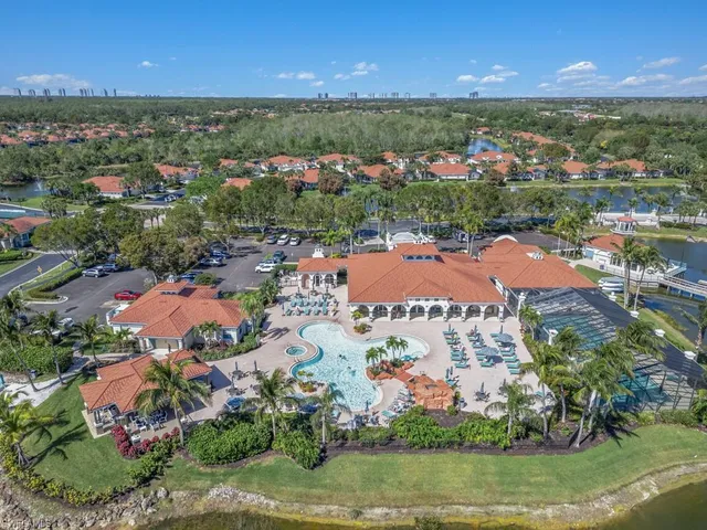 an aerial view of residential houses with outdoor space and street view
