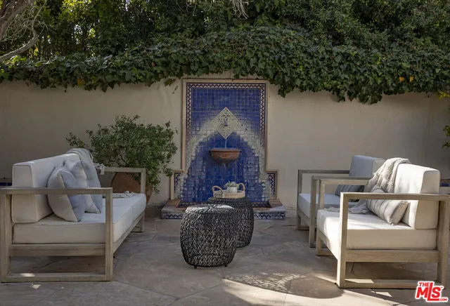 a spacious bedroom with a large bed and a large window