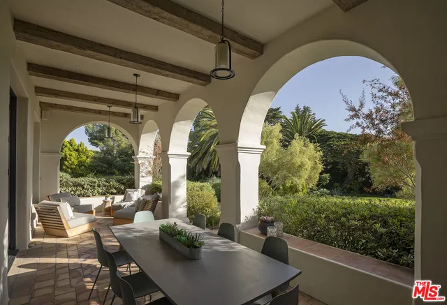 a kitchen with sink refrigerator and couches