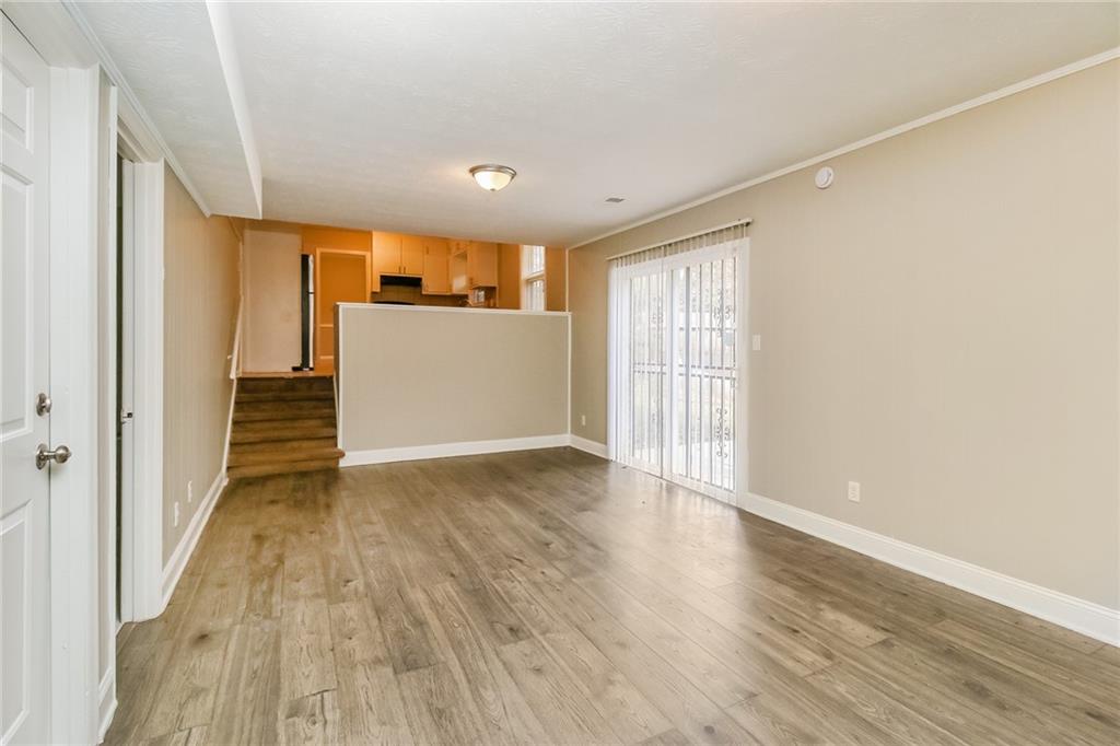 4033 Emerald N Circle Decatur, GA 30035 - Photo 12 of 25 a view of a big room with wooden floor and entryway