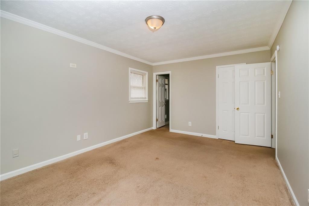 4033 Emerald N Circle Decatur, GA 30035 - Photo 14 of 25 an empty room with a fan & a window