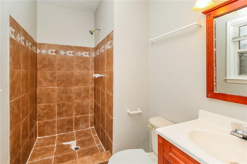 4033 Emerald N Circle Decatur, GA 30035 - Photo 15 of 25 a bathroom with a sink toilet and shower