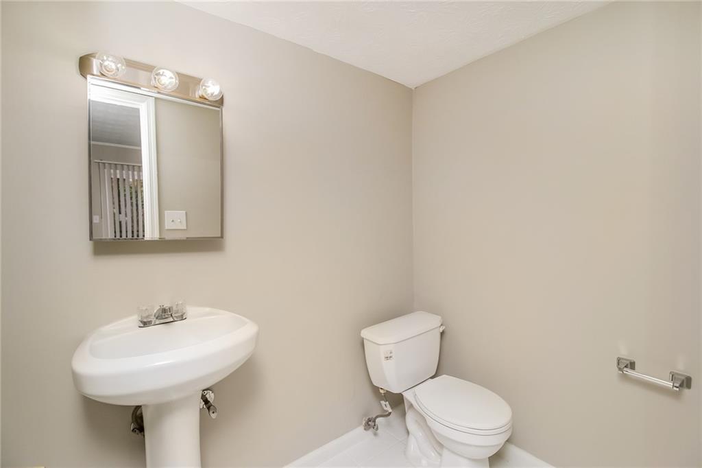 4033 Emerald N Circle Decatur, GA 30035 - Photo 24 of 25 a bathroom with a toilet sink and mirror