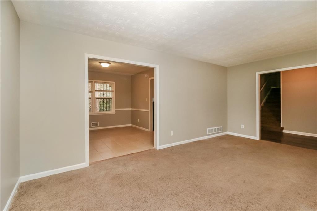 4033 Emerald N Circle Decatur, GA 30035 - Photo 4 of 25 a view of an empty room with a fireplace