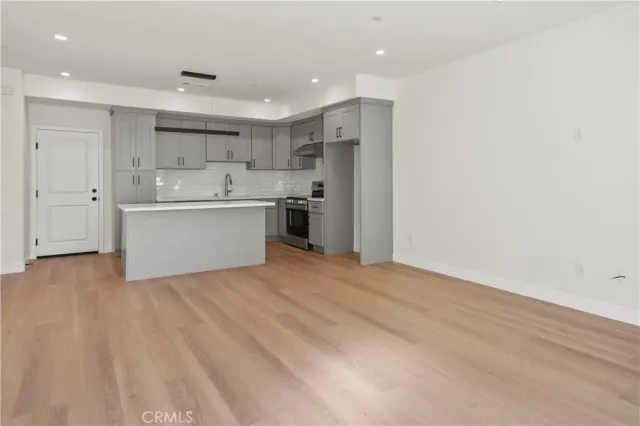 a view of kitchen with wooden floor