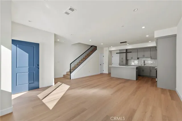 a view of a kitchen with sink and cabinet