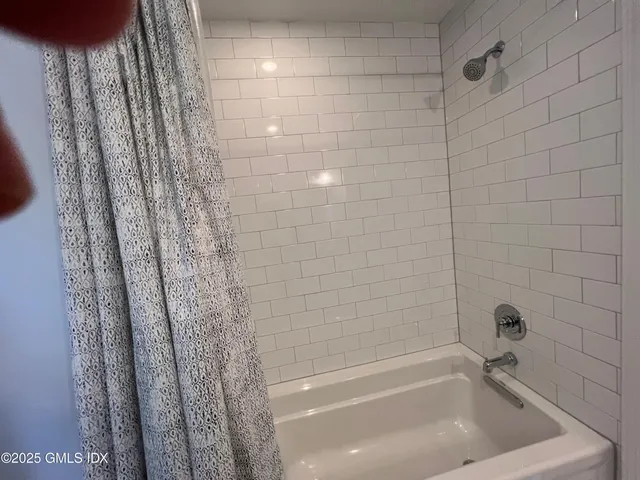 a bathroom with a bathtub