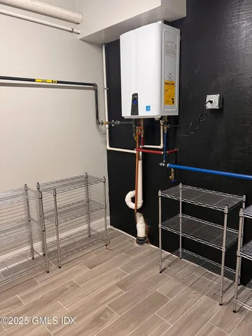 a bedroom with a bed and a mirror