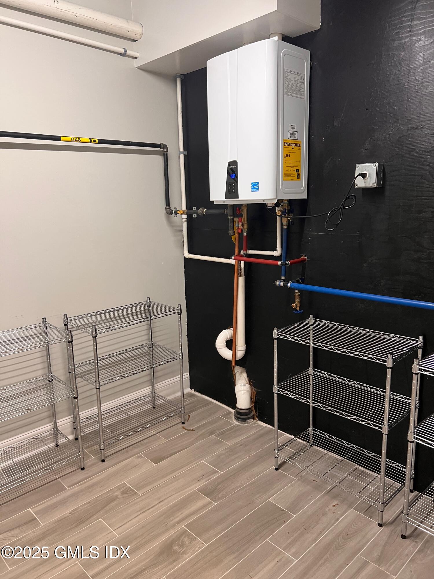 31 Moshier Street, Unit B Greenwich, CT 06831 - Photo 24 of 28 a bedroom with a bed and a mirror