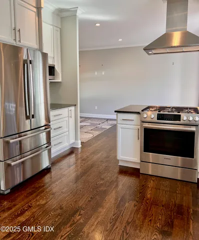 a kitchen with a stove and a refrigerator