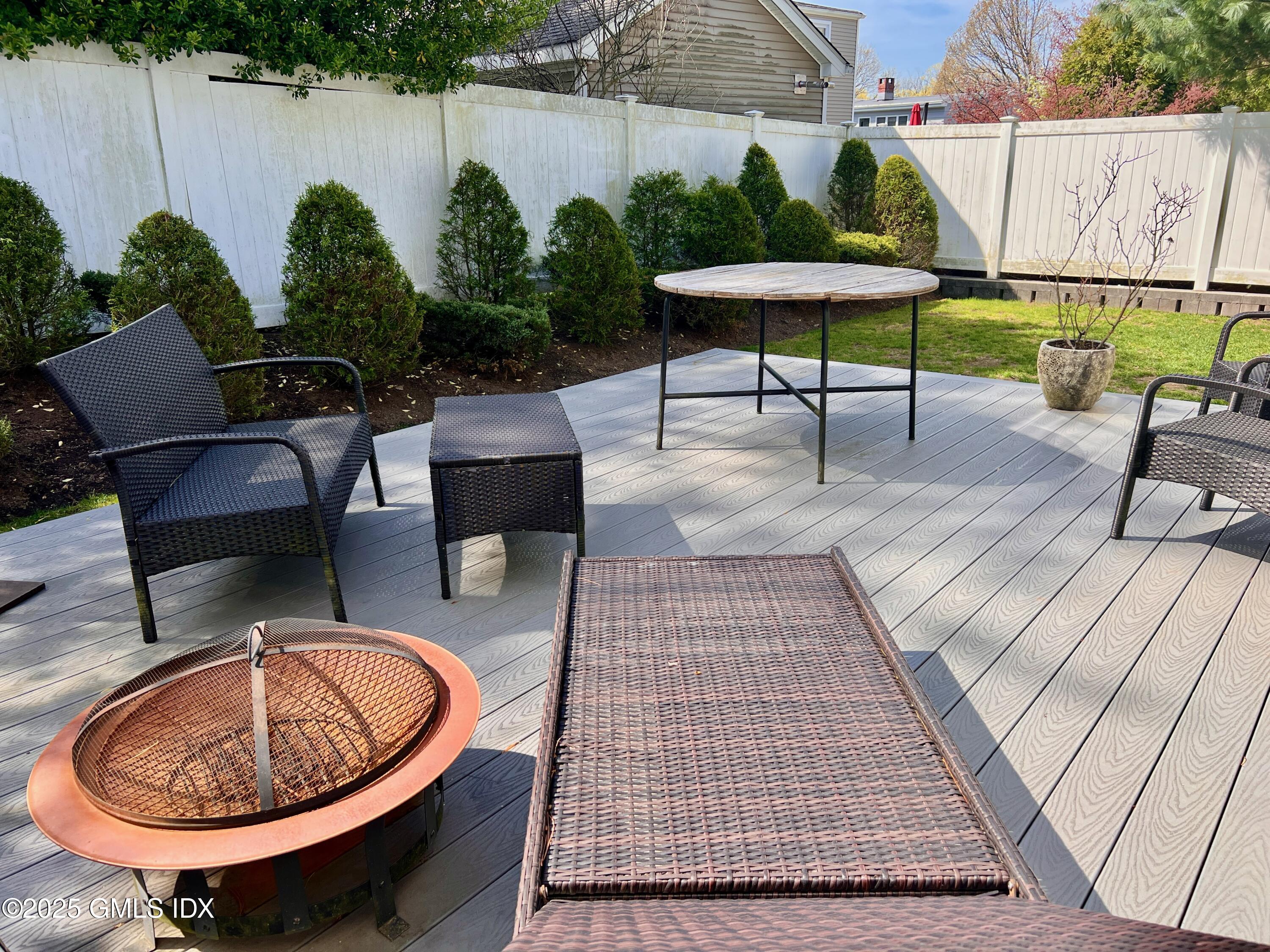 31 Moshier Street, Unit B Greenwich, CT 06831 - Photo 6 of 28 a view of a backyard with furniture and a garden