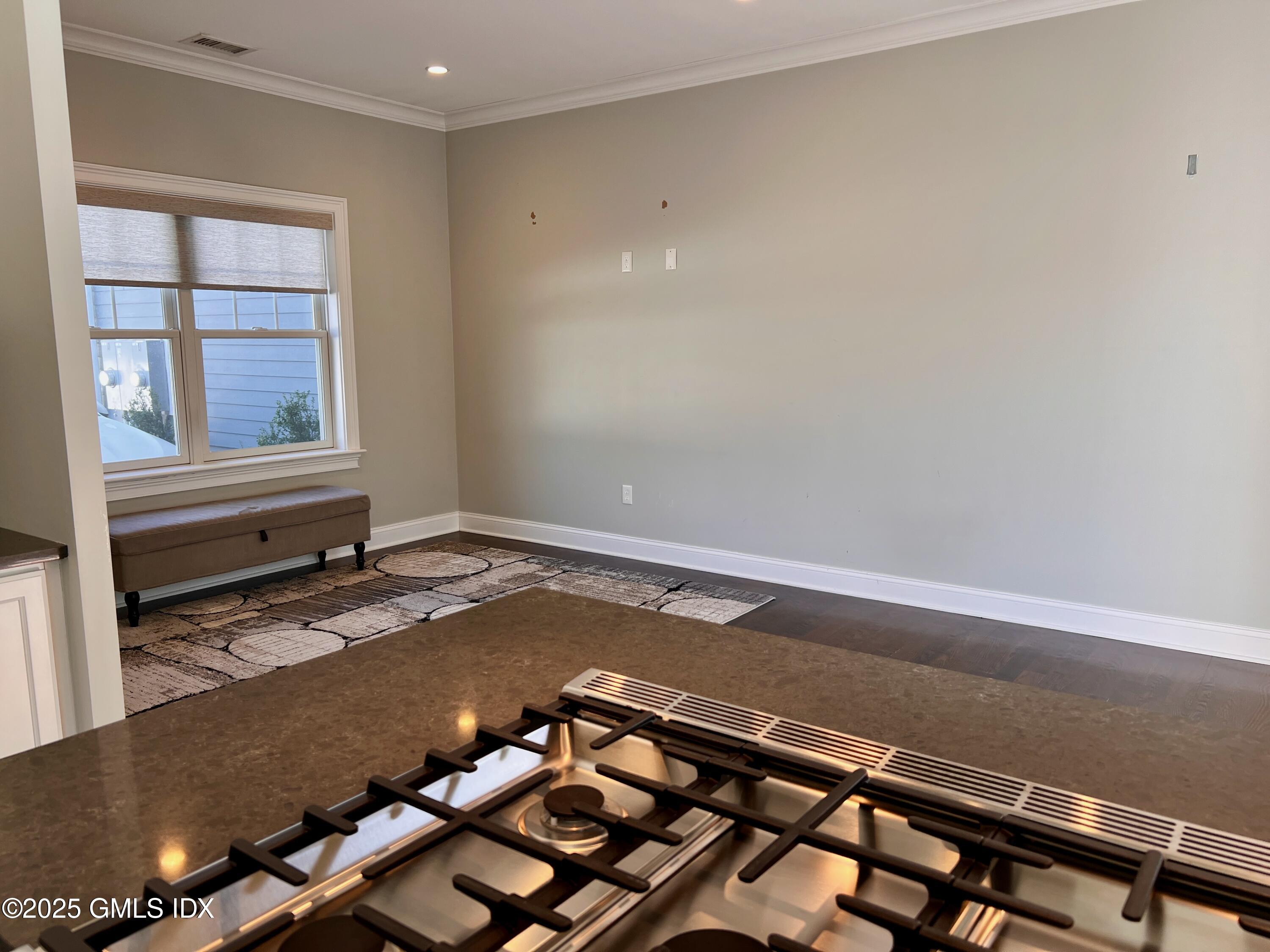 31 Moshier Street, Unit B Greenwich, CT 06831 - Photo 9 of 28 a view of a room with wooden floor