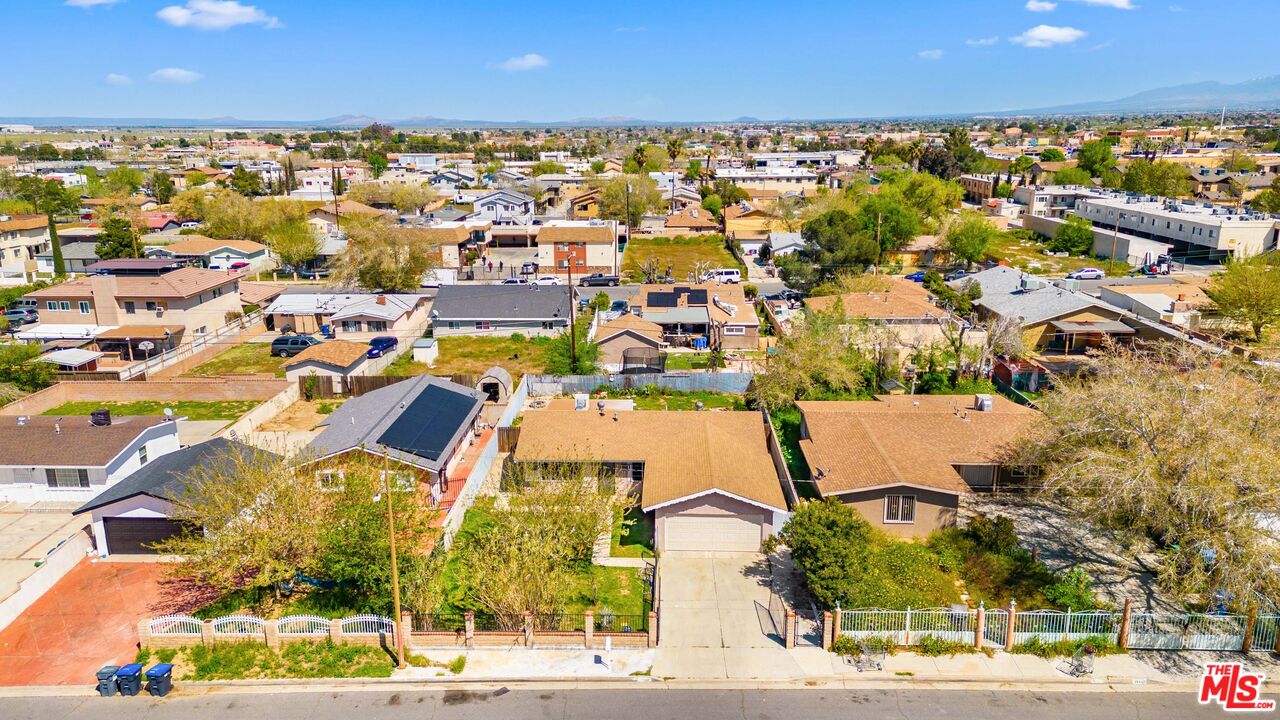 38466 Sumac Avenue Palmdale, CA 93550 - Photo 1 of 18 an aerial view of residential houses with outdoor space