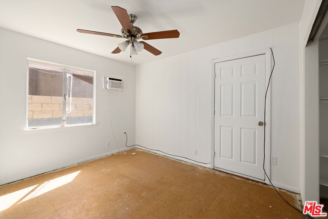 38466 Sumac Avenue Palmdale, CA 93550 - Photo 12 of 18 a view of a room with a window and a ceiling fan