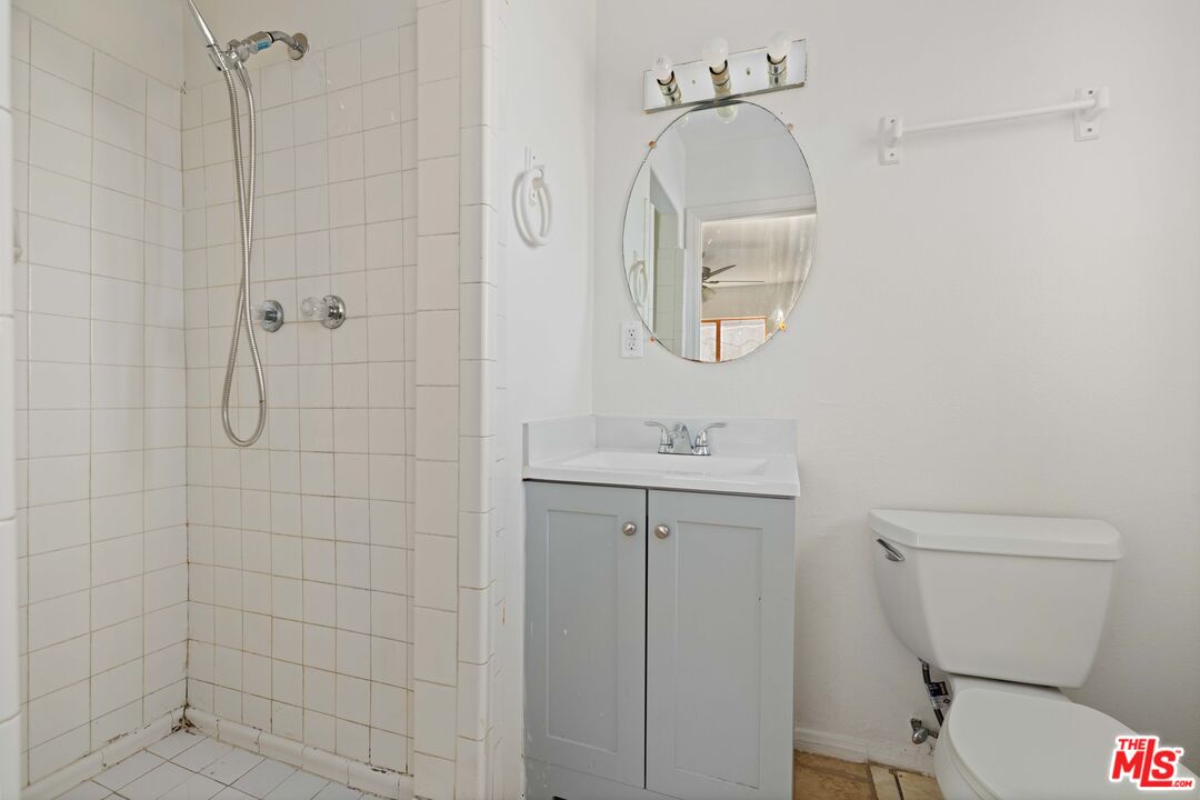 38466 Sumac Avenue Palmdale, CA 93550 - Photo 14 of 18 a bathroom with a toilet sink and shower