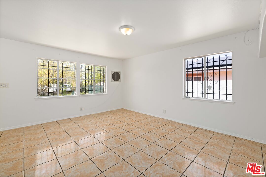 38466 Sumac Avenue Palmdale, CA 93550 - Photo 5 of 18 a view of an empty room and window