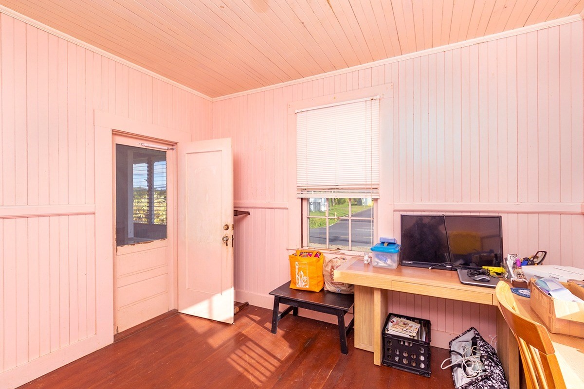 18-1222 Volcano Road Mountain View, HI 96771 - Photo 13 of 29 a view of a workspace with furniture and a window