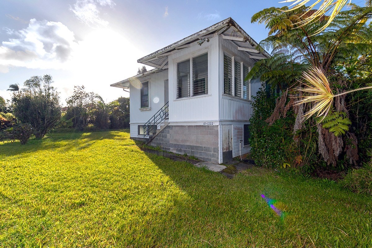 18-1222 Volcano Road Mountain View, HI 96771 - Photo 4 of 29 a view of a house with a yard and plants