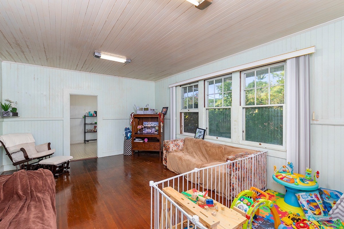 18-1222 Volcano Road Mountain View, HI 96771 - Photo 8 of 29 a bedroom with furniture and a window