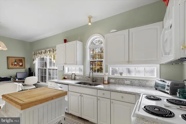 a kitchen with sink and window