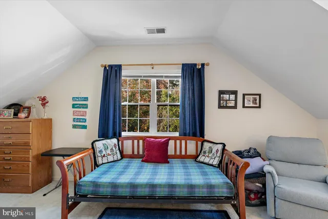 a bed room with furniture and a window