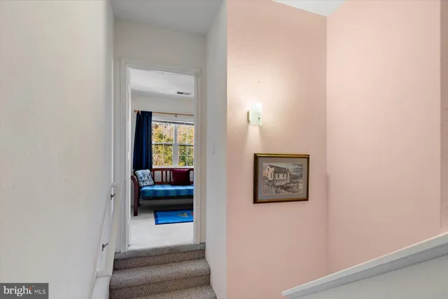 a bedroom with a bed dresser and a window