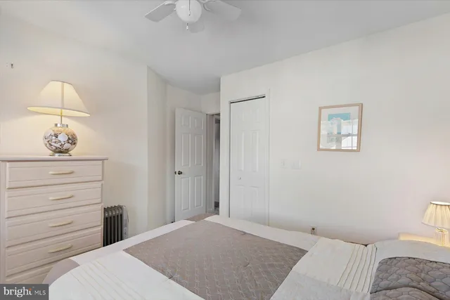a bathroom with a sink and mirror with toilet