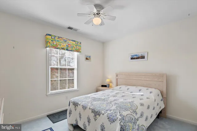 a room with a bed and a mirror