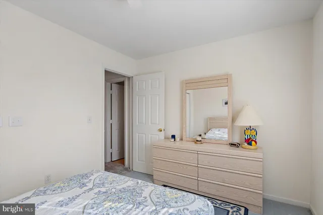 a bedroom with a bed and a television