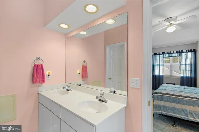 a front view of white house with a small yard