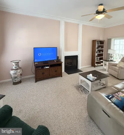 a kitchen with a sink a stove a refrigerator cabinets and a window
