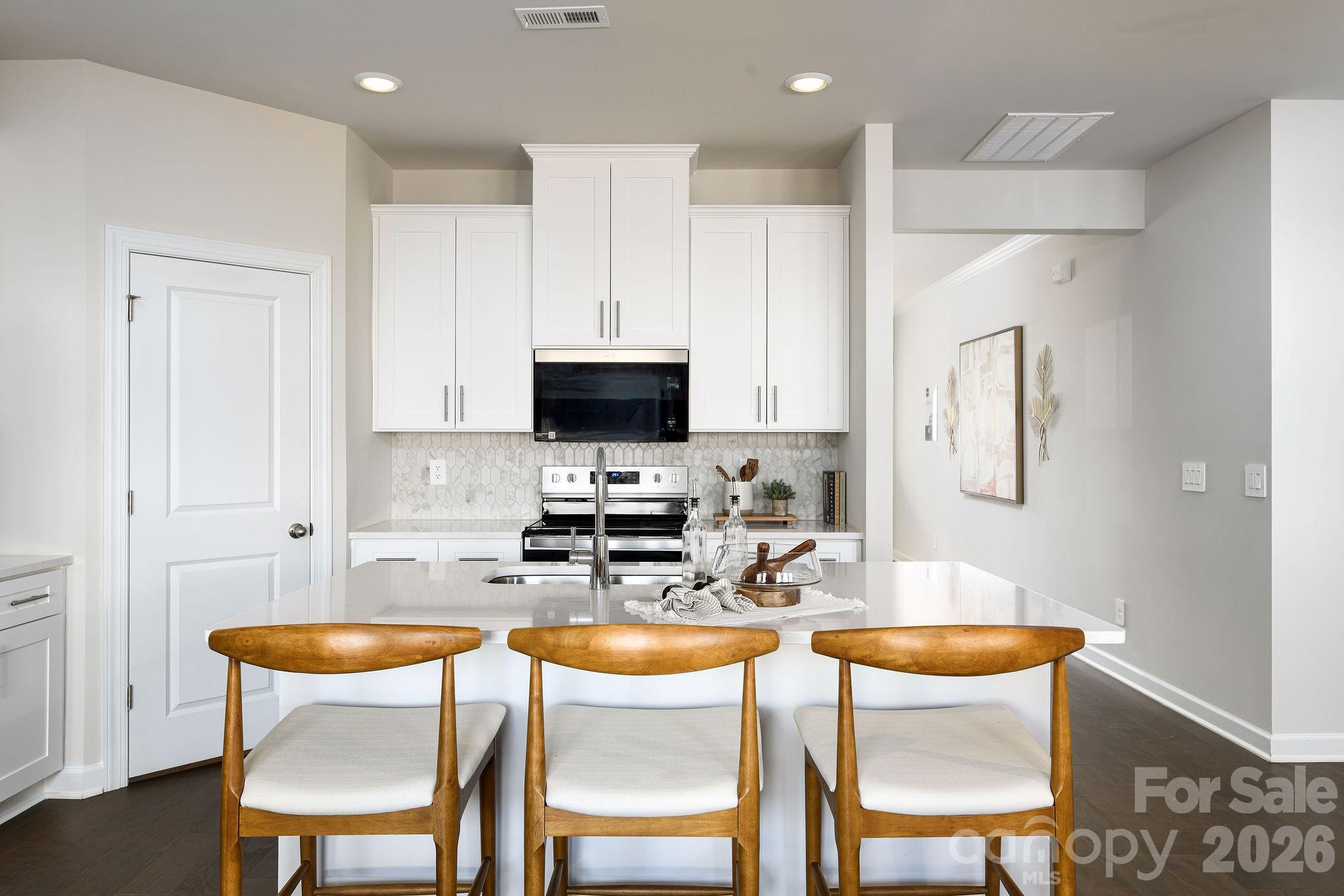 179 Murphy Mdw Road Mocksville, NC 27028 - Photo 16 of 43 a table and chairs in a kitchen