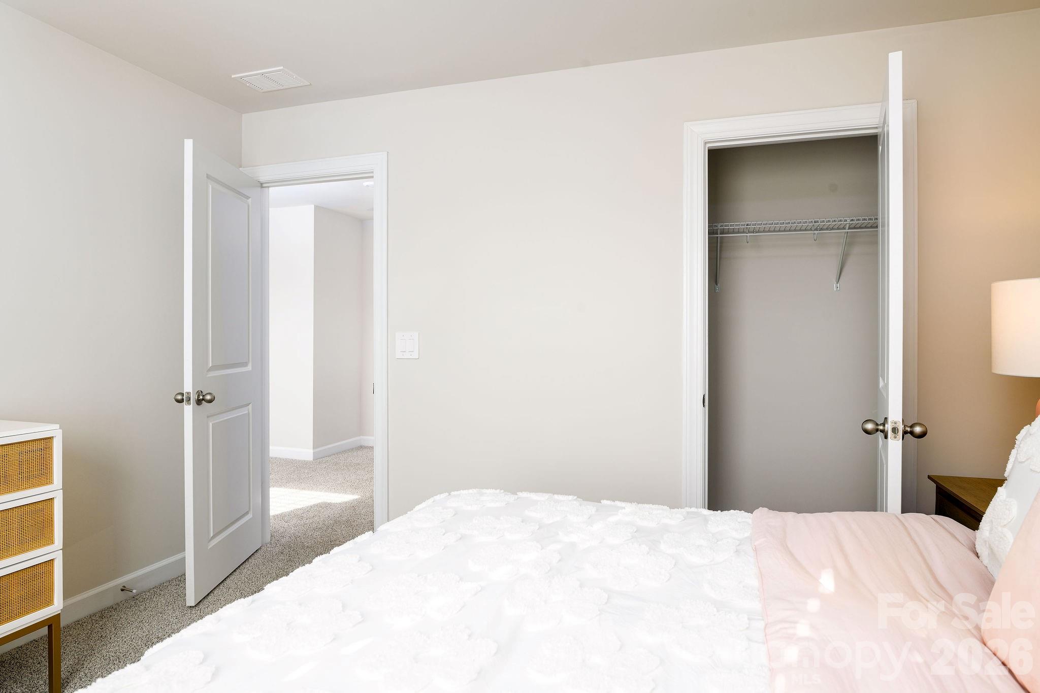 179 Murphy Mdw Road Mocksville, NC 27028 - Photo 24 of 43 a bedroom with a bed and a cabinets