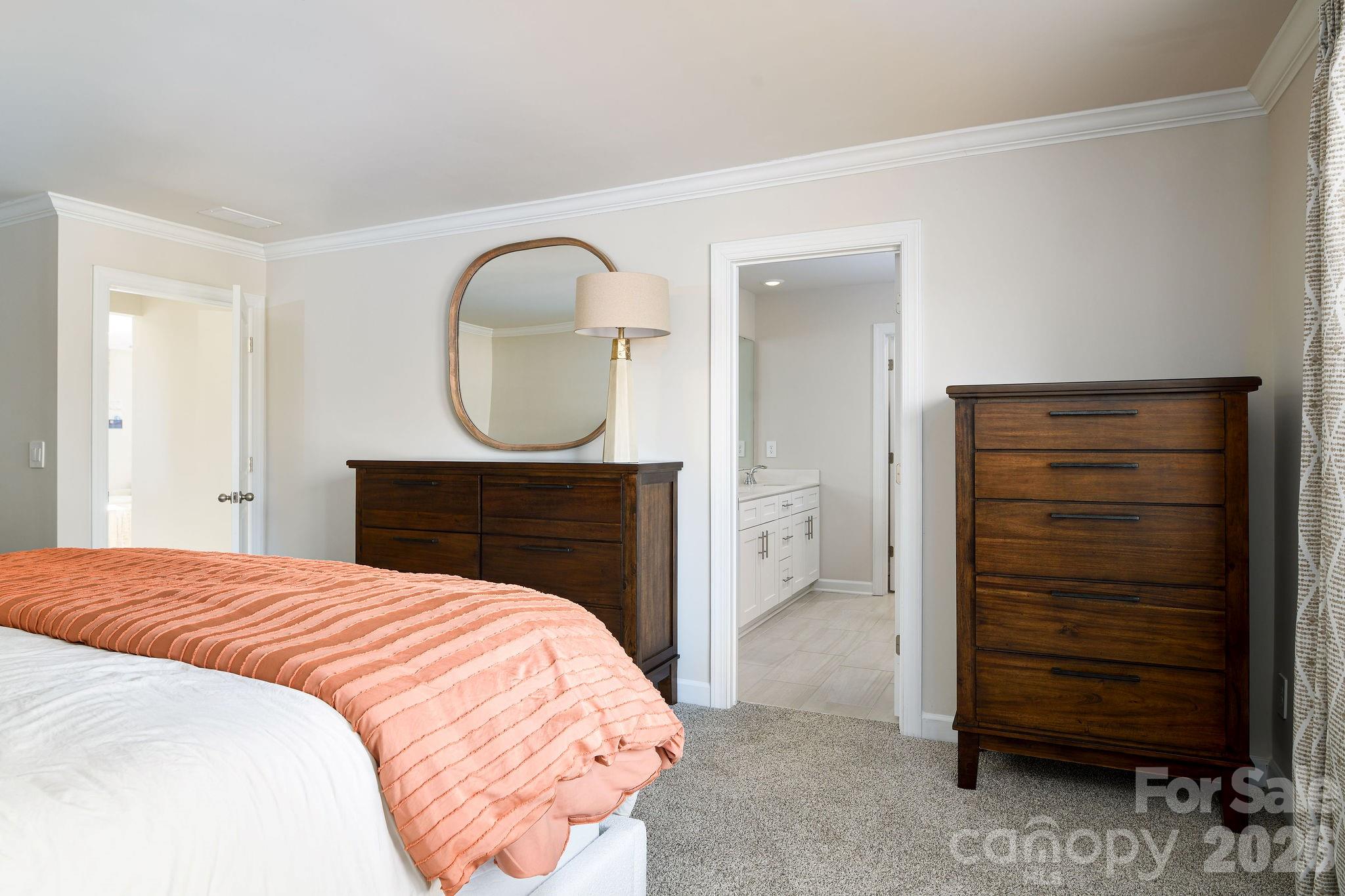 179 Murphy Mdw Road Mocksville, NC 27028 - Photo 27 of 43 a bedroom with a bed and a mirror