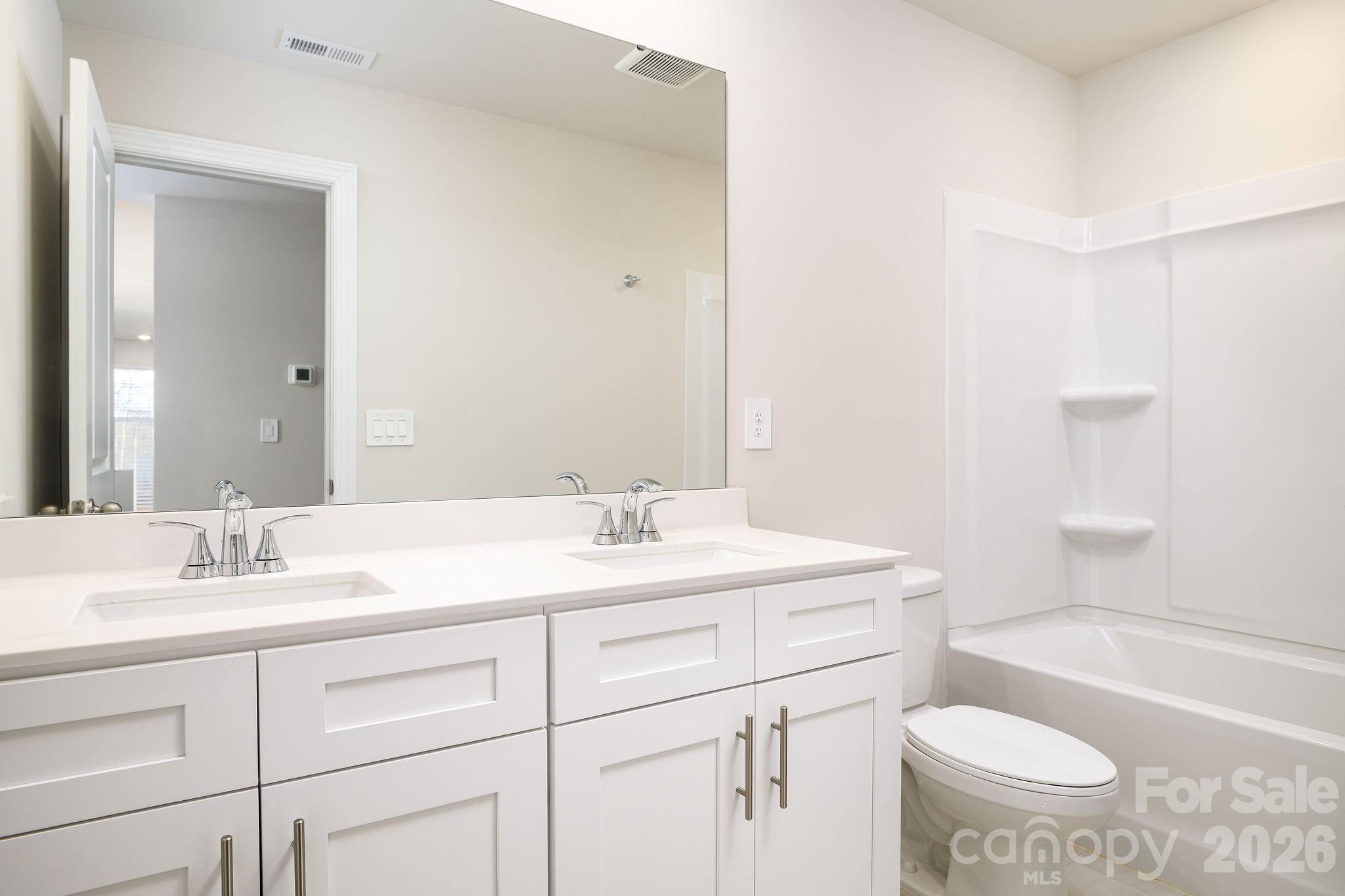 179 Murphy Mdw Road Mocksville, NC 27028 - Photo 33 of 43 a bathroom with a sink a toilet and a bathtub