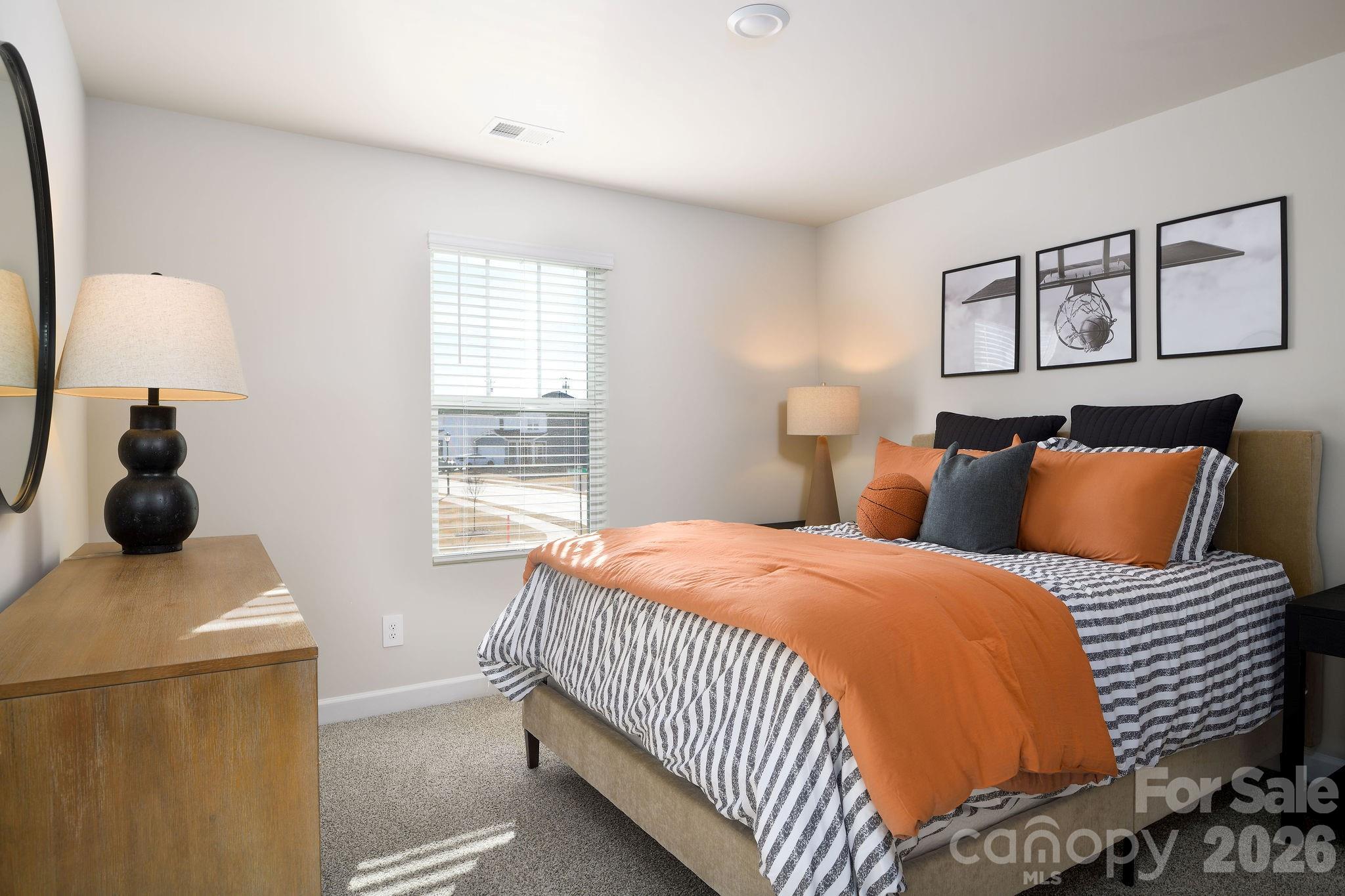 179 Murphy Mdw Road Mocksville, NC 27028 - Photo 34 of 43 a bedroom with a bed and a window