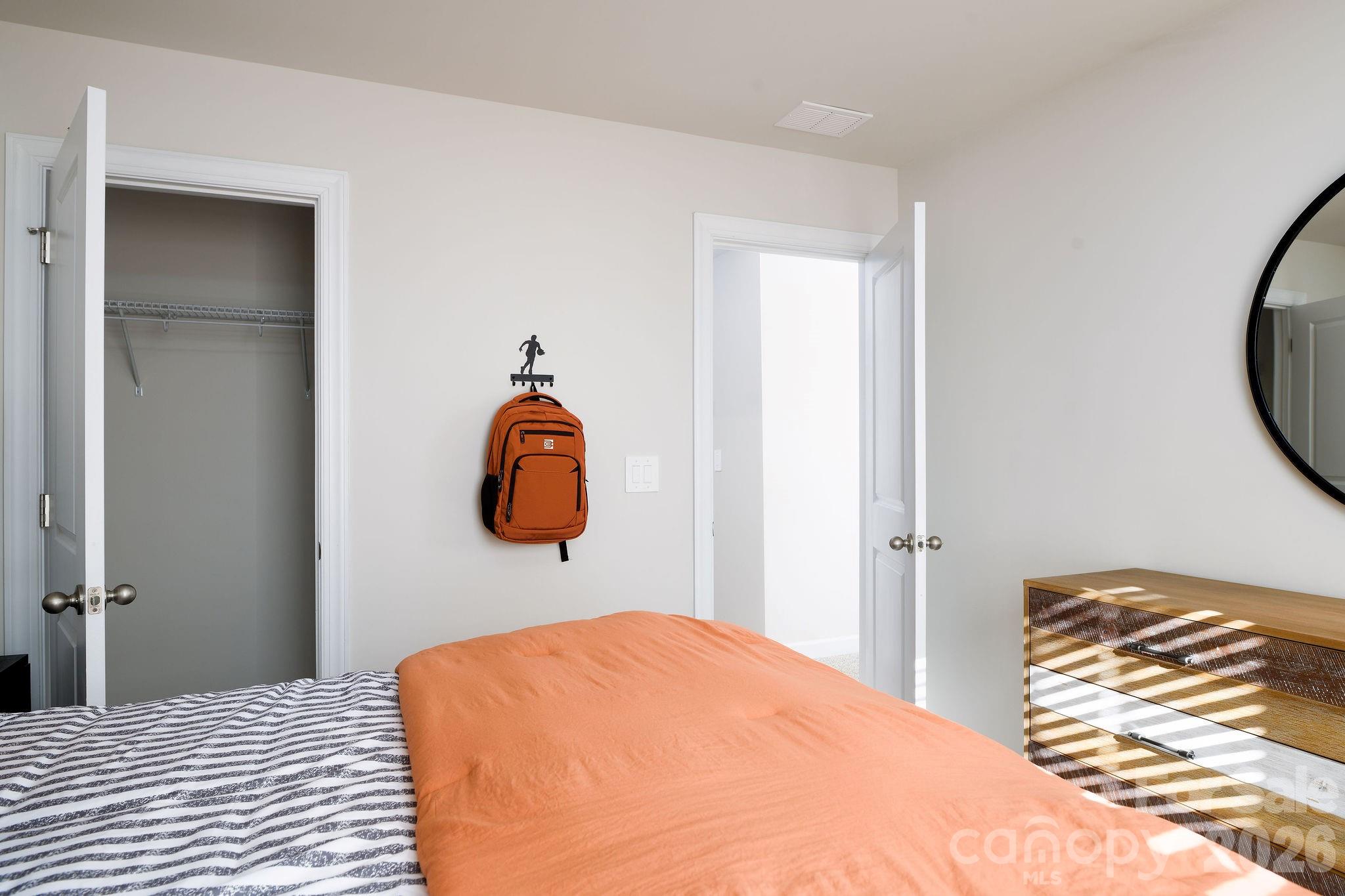 179 Murphy Mdw Road Mocksville, NC 27028 - Photo 35 of 43 a bedroom with a bed and a painting on the wall