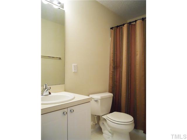 2004 Metacomet Way Raleigh, NC 27604 - Photo 13 of 23 a bathroom with a sink a toilet and shower