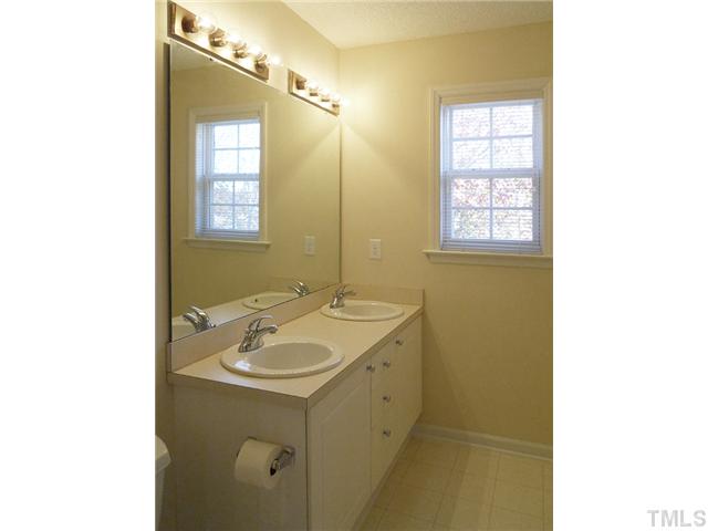 2004 Metacomet Way Raleigh, NC 27604 - Photo 16 of 23 a bathroom with a sink and a mirror
