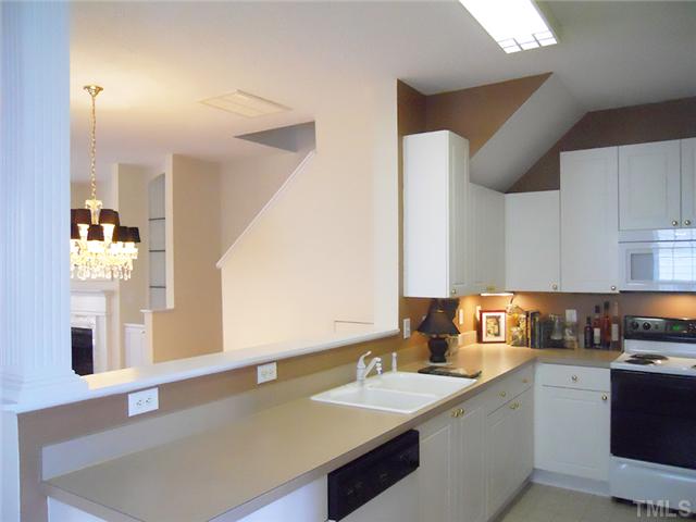 2004 Metacomet Way Raleigh, NC 27604 - Photo 7 of 23 a kitchen with a sink cabinets and window