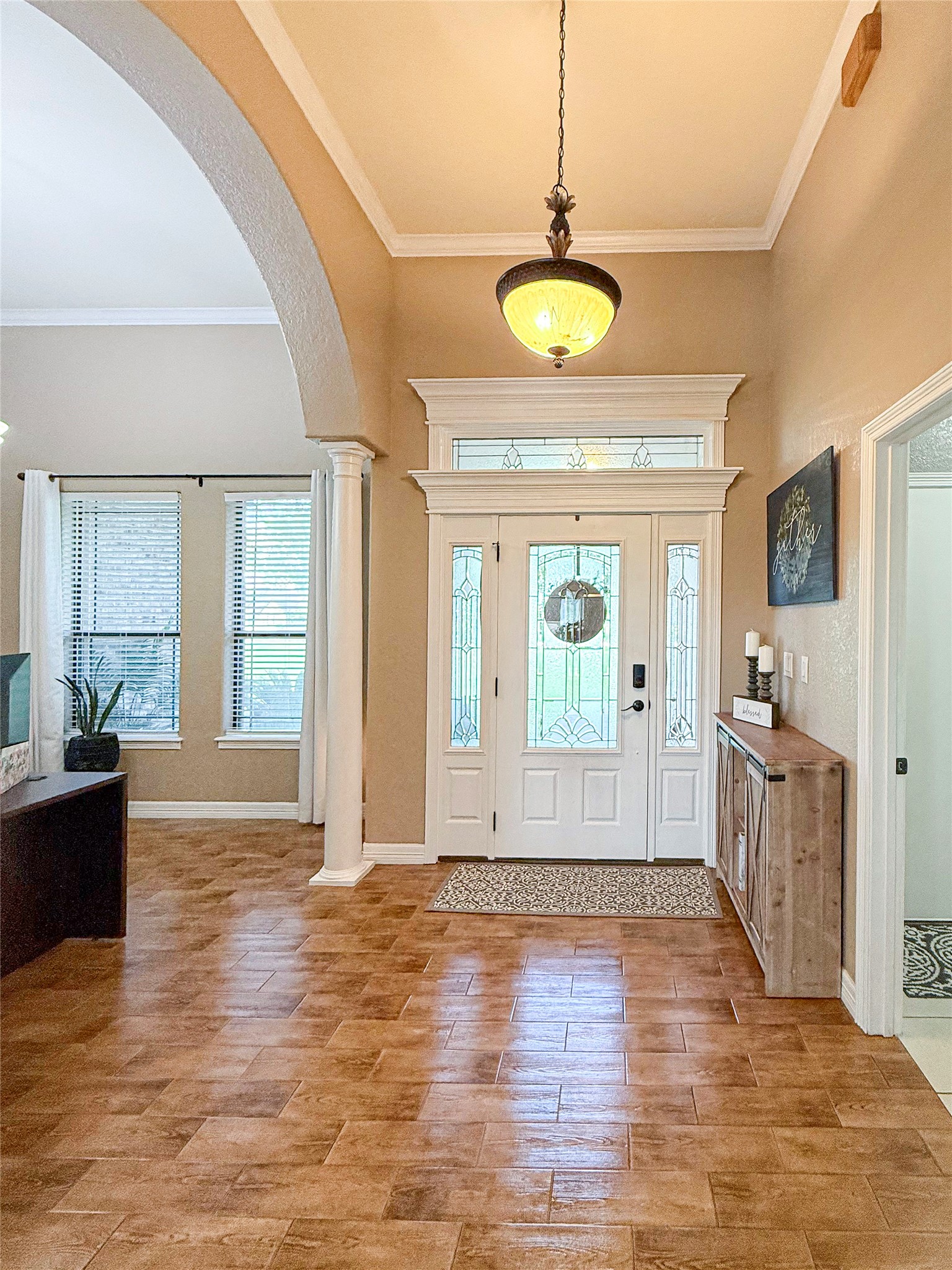 807 Mill Road Angleton, TX 77515 - Photo 9 of 46 Elegant entry showcases crown molding and timeless craftsmanship.