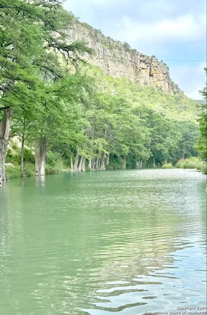 a view of lake with green space