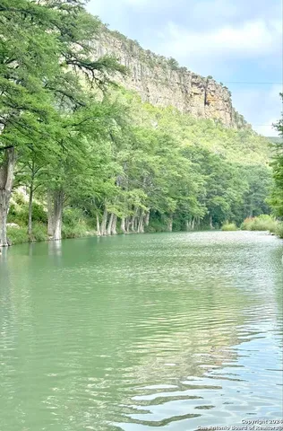 a view of lake with green space