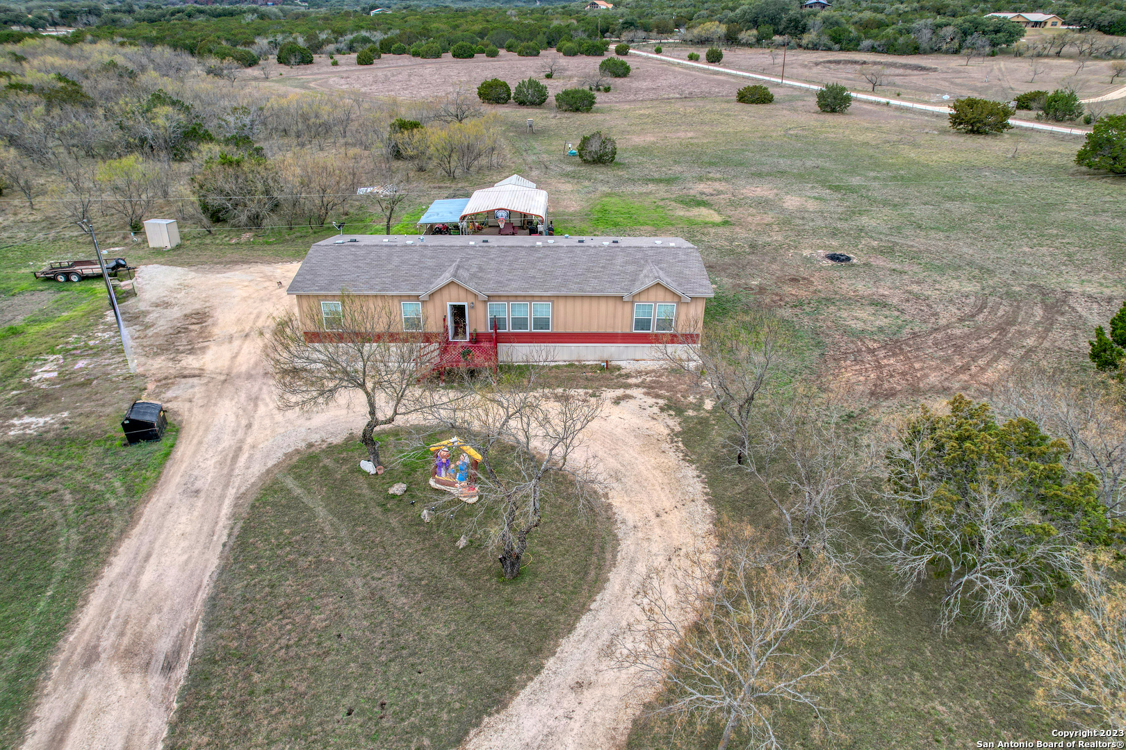 1189 North A Cr Concan, TX 78838 - Photo 28 of 68 a view of a house with a yard