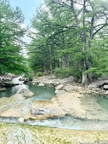 a view of a patio with a table and chairs