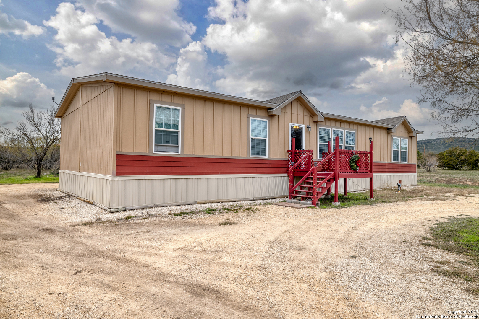 1189 North A Cr Concan, TX 78838 - Photo 35 of 68 a view of a house with backyard and trees