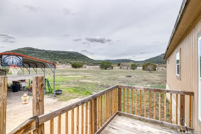 a bedroom with a bed a desk and chair