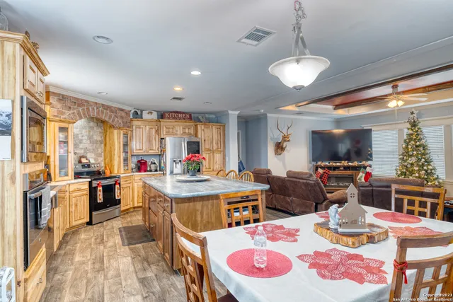a view of a living room with a fireplace and a rug